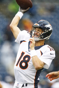 Aug 14, 2015; Seattle, WA, USA; Denver Broncos quarterback Peyton Manning (18) participates in warmups before a preseason NFL football game against the Seattle Seahawks at CenturyLink Field. Mandatory Credit: Joe Nicholson-USA TODAY Sports