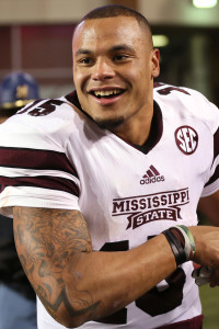 Nov 21, 2015; Fayetteville, AR, USA; Mississippi State Bulldogs quarterback Dak Prescott (15) celebrates after the game against the Arkansas Razorbacks at Donald W. Reynolds Razorback Stadium. Mississippi State defeated Arkansas 51-50. Mandatory Credit: Nelson Chenault-USA TODAY Sports