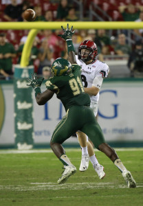 Nov 20, 2015; Tampa, FL, USA; Cincinnati Bearcats quarterback Hayden Moore (8) throws the ball as South Florida Bulls defensive end Eric Lee (91) defends during the second half at Raymond James Stadium. South Florida Bulls defeated the Cincinnati Bearcats 65-27. Mandatory Credit: Kim Klement-USA TODAY Sports