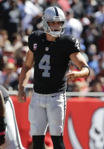 Oct 30, 2016; Tampa, FL, USA; Oakland Raiders quarterback Derek Carr (4) calls a play against the Tampa Bay Buccaneers during the second quarter at Raymond James Stadium. Mandatory Credit: Kim Klement-USA TODAY Sports