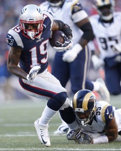 Dec 4, 2016; Foxborough, MA, USA; New England Patriots wide receiver Malcolm Mitchell (19) is tackled by Los Angeles Rams defensive back Michael Jordan (35) during the second quarter at Gillette Stadium. Mandatory Credit: Greg M. Cooper-USA TODAY Sports