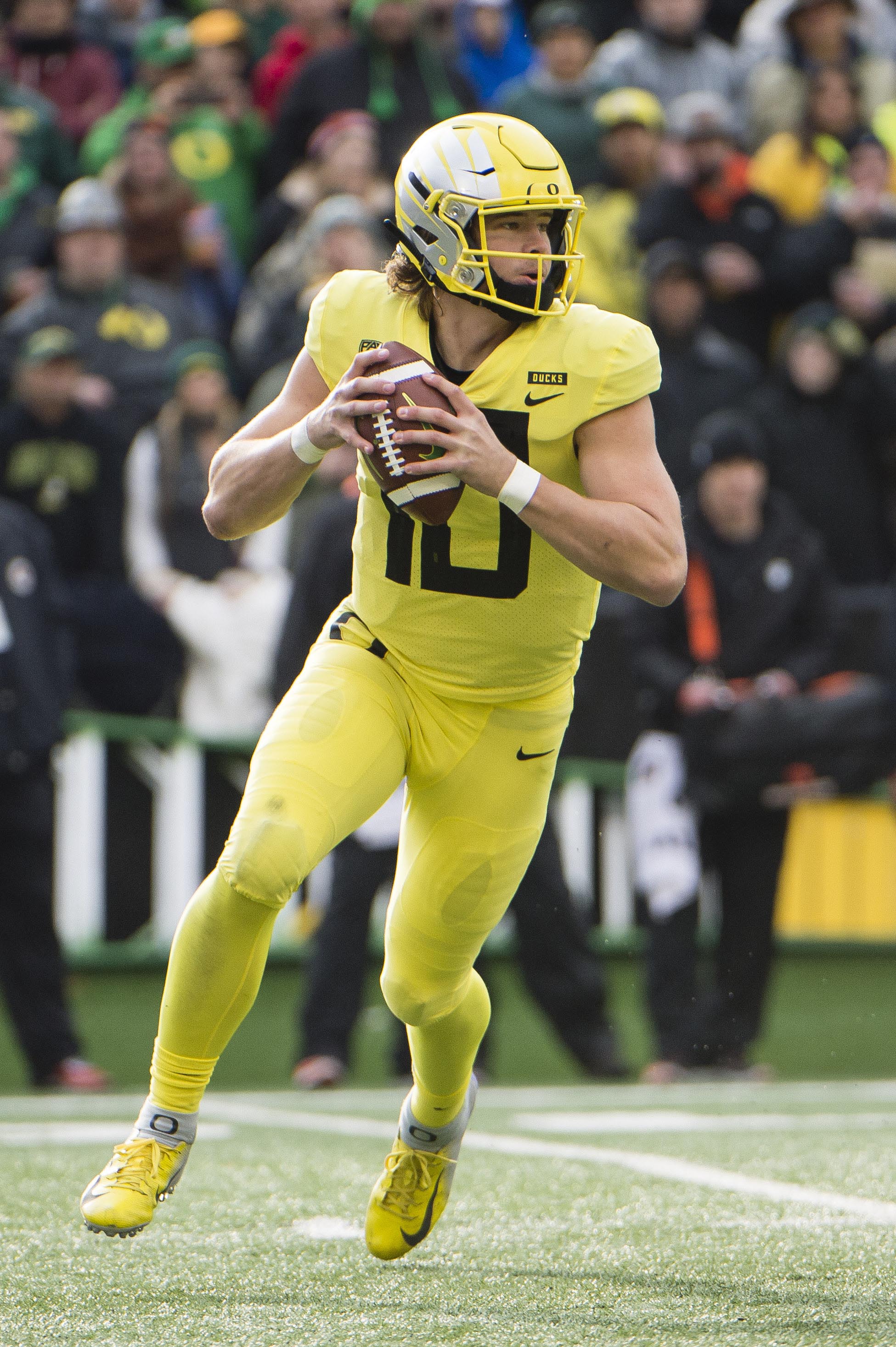 Justin Herbert of the Oregon Ducks looks to pass against the