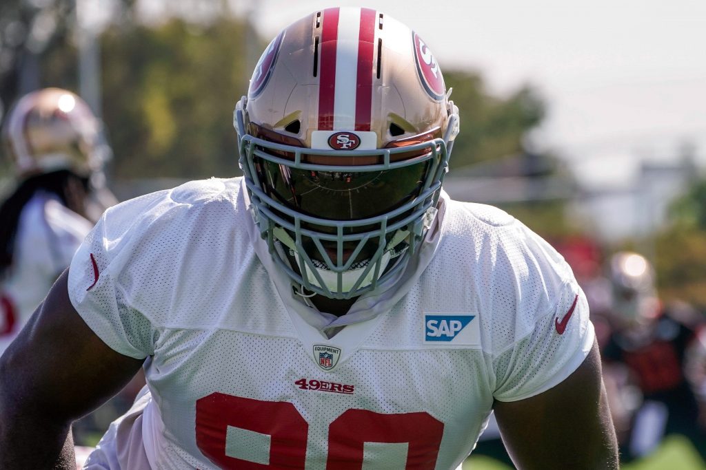 San Francisco 49ers defensive tackle Earl Mitchell stretches