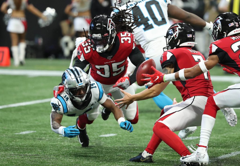 Greg Dortch of the Arizona Cardinals avoids a tackle after making